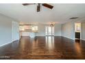 Bright and airy living room featuring hardwood floors and seamless transitions to other living spaces at 6820 E Pinchot Ave, Scottsdale, AZ 85251