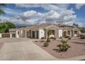 Well-maintained home featuring a desert landscape, tile roof, and a circular driveway for curb appeal at 9612 W Mariposa Grande --, Peoria, AZ 85383