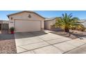 Attractive single-level home with a two-car garage, low maintenance desert landscaping and concrete driveway at 1339 E Silverbrush Trl, Casa Grande, AZ 85122