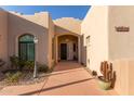 Inviting entryway featuring a decorative front door and arched doorway at 20212 E Appaloosa Dr, Queen Creek, AZ 85142