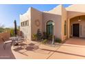 Private outdoor patio with dining set and desert landscaping for relaxing and entertaining at 20212 E Appaloosa Dr, Queen Creek, AZ 85142