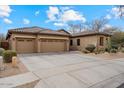 Charming home with a spacious three-car garage and well-maintained desert landscaping at 2025 W Calle Del Sol --, Phoenix, AZ 85085