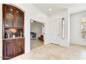 Foyer features built in cabinet with a view to office space at 22503 N 76Th Pl, Scottsdale, AZ 85255