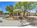 A well-maintained home with desert landscaping and a spacious two-car garage and driveway at 22503 N 76Th Pl, Scottsdale, AZ 85255