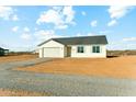 Beautiful single-story home with a two-car garage, neutral paint, and an expansive gravel driveway at 2762 S 357Th Dr, Tonopah, AZ 85354