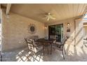 Cozy covered patio with a ceiling fan and comfortable seating area, perfect for outdoor relaxation at 315 Leisure World --, Mesa, AZ 85206