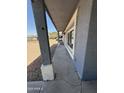 Exterior view from the walkway showing a gray paint color with a white trim around the windows at 4221 N 33Rd Dr, Phoenix, AZ 85017