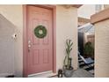 Inviting front door with a wreath, leading to a cozy entryway at 42424 N Gavilan Peak Pkwy # 30104, Anthem, AZ 85086