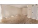 Spacious living room with neutral paint, tile flooring, and abundant natural light, ready for personalization at 4610 N 68Th St # 402, Scottsdale, AZ 85251