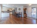 Open concept kitchen and dining area with modern cabinets and stainless steel appliances at 4815 E Kiva St, Phoenix, AZ 85044