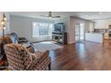 Bright living room featuring hardwood floors, and an open layout to the kitchen at 4815 E Kiva St, Phoenix, AZ 85044