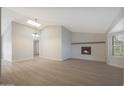Bright and airy living room with a fireplace, large windows, and hardwood floors at 6431 W Monte Cristo Ave, Glendale, AZ 85306