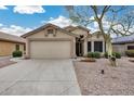 Charming single-story home with a well-kept front yard and desert landscaping at 6664 W Rose Garden Ln, Glendale, AZ 85308