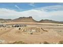 New home construction site with stunning mountain views and clear blue skies in a serene neighborhood at 740 W Patrick Pl, San Tan Valley, AZ 85143