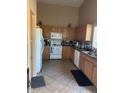 Functional kitchen featuring essential appliances, ample cabinetry, and neutral color palette at 1759 N Sinova --, Mesa, AZ 85205