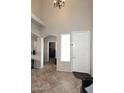 Inviting foyer featuring tile floors, arched doorways, and a view into other rooms at 1765 N Agave St, Casa Grande, AZ 85122