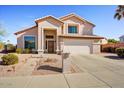 Charming two-story home with landscaped front yard and paved walkway at 2130 E Knudsen Dr, Phoenix, AZ 85024