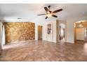 Spacious living room showcasing tile floors, custom wall accents, and open archways to other rooms at 383 E Jasper Dr, Chandler, AZ 85225