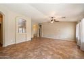 Expansive living room with tile flooring, neutral color scheme, and open layout for versatile furniture arrangement at 383 E Jasper Dr, Chandler, AZ 85225