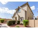 Side view of a two-story home with desert landscaping and shuttered windows at 4675 E Olney Ave, Gilbert, AZ 85234