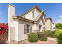 Two-story home with desert landscaping, a chimney, and shuttered windows under a clear, blue sky at 4675 E Olney Ave, Gilbert, AZ 85234