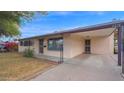 Well-maintained single-story home with a covered carport at 6405 N 46Th Dr, Glendale, AZ 85301