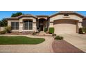 Charming single-Gathering home featuring manicured landscaping and a welcoming front entrance at 6494 W Matilda Ln, Glendale, AZ 85308