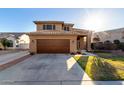 Beautiful home featuring an attached two car garage, tiled roof, and a covered front porch at 7371 W Louise Dr, Glendale, AZ 85310