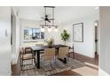 Contemporary dining room featuring a stylish light fixture, modern furniture and large windows at 7819 N 17Th Ave, Phoenix, AZ 85021