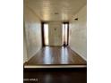 Inviting entryway featuring hardwood floors and a front door with decorative accents at 7921 W Pinchot Ave, Phoenix, AZ 85033