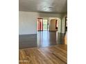 Bright living area featuring luxury vinyl plank flooring and an open floor plan at 7921 W Pinchot Ave, Phoenix, AZ 85033