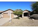 Charming single-Gathering home with desert landscaping, a two-car garage, and a welcoming front porch at 10572 E Tierra Buena Ln, Scottsdale, AZ 85255