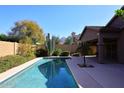 Stunning pool with desert landscaping, including a large Saguaro cactus and mountain views at 10572 E Tierra Buena Ln, Scottsdale, AZ 85255