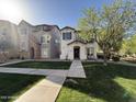 Inviting two-story home with a landscaped front yard and charming curb appeal at 1304 S Owl Dr, Gilbert, AZ 85296