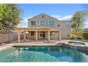 Backyard oasis featuring a refreshing pool, spa, and covered patio for outdoor relaxation at 2670 E Parkview Dr, Gilbert, AZ 85295