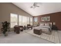 A spacious bedroom with a sitting area, plush bed, and ample natural light at 4531 W Flint St, Chandler, AZ 85226