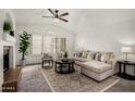 Bright living room with fireplace, plantation shutters, and neutral decor providing a cozy atmosphere at 4558 E Vista Dr, Phoenix, AZ 85032