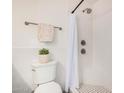 Updated bathroom with tiled shower, mosaic flooring, and modern fixtures at 5142 E Holly St, Phoenix, AZ 85008