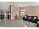 Spacious living room featuring tile floors, neutral paint, and a ceiling fan at 6632 E Fairbrook Cir, Mesa, AZ 85205