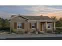 Charming single-story home featuring desert landscaping and a welcoming covered front porch at 9956 W Piccadilly Rd, Avondale, AZ 85392