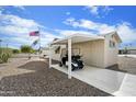 View of covered golf cart parking and storage behind this desirable home at 1139 S 79Th St, Mesa, AZ 85208