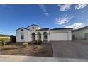 Charming single-story home with an attached two-car garage and beautifully landscaped front yard at 17019 W Cameron Dr, Surprise, AZ 85388