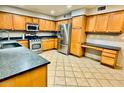 Spacious kitchen features stainless steel appliances and ample counter space at 17059 W Northampton Rd, Surprise, AZ 85374