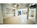 Bright and airy living area with high ceilings, tiled floors, and access to the backyard at 17059 W Northampton Rd, Surprise, AZ 85374