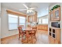 Open kitchen and dining area with light wood cabinets, offering a cozy and functional space at 17200 W Bell Rd # 1185, Surprise, AZ 85374