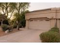 Charming home featuring desert landscaping, including saguaro and barrel cactus and a two car garage at 18932 N 89Th Way, Scottsdale, AZ 85255