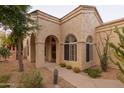 Charming home featuring desert landscaping, including saguaro and barrel cactus and a covered front entrance at 18932 N 89Th Way, Scottsdale, AZ 85255