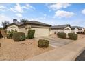 A single-story home with a two-car garage, desert landscaping, and well-kept curb appeal at 3018 W Matthew Dr, Phoenix, AZ 85027