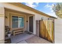 Inviting front porch area with seating, a decorative fence, and a well-manicured garden at 3018 W Matthew Dr, Phoenix, AZ 85027