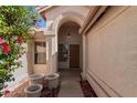 Inviting entryway featuring a wood door and tiled floor at 3191 N 160Th Ave, Goodyear, AZ 85395